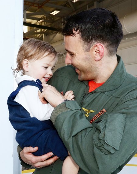 Photo Gallery: Family and U.S. Navy officials greet return of NAS Lemoore F-35 aviators to Lemoore from first sea deployment Aviator Daniel Armenteros plays with son Teddy after landing his jet Saturday afternoon.